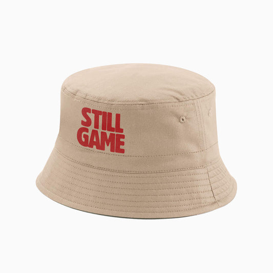 A natural coloured Bucket Hat with embroidered Still Game text.