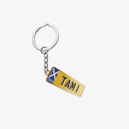 Soft enamel keyring in the shape of Tam Mullen's TAM 1 private registration plate.