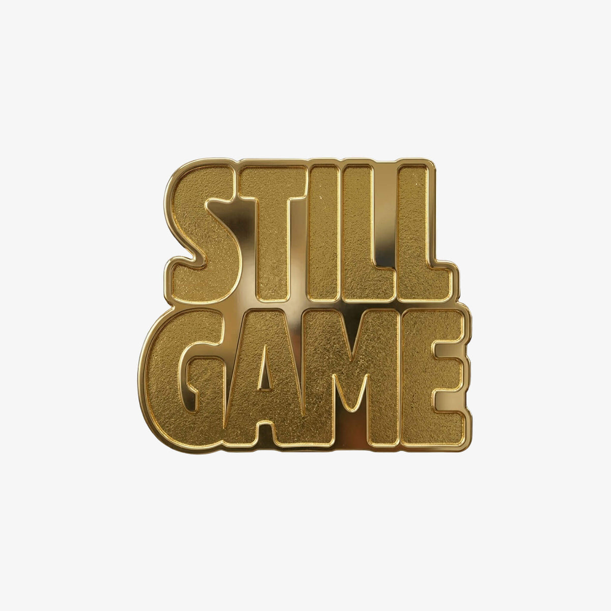 Gold coloured metal pin badge in the shape of the Still Game text.