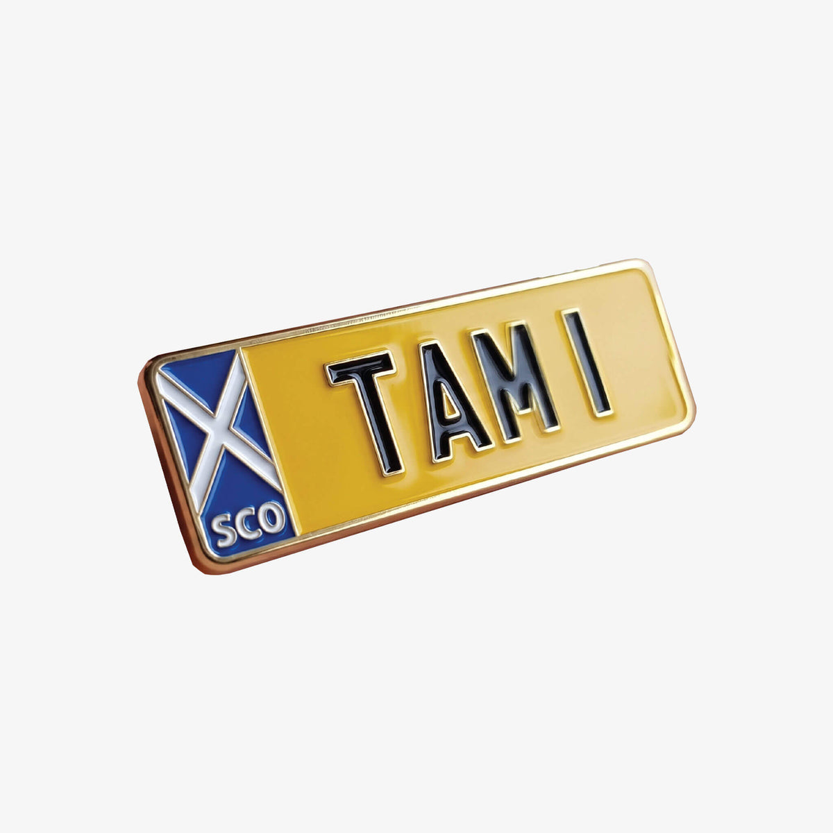 Soft enamel pin badge in the shape of Tam Mullen's TAM 1 private number plate