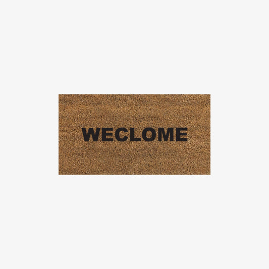 Rectangular adhesive vinyl window sticker with Weclome Mat design